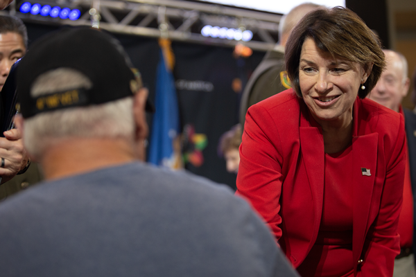 Senator Amy Klobuchar, in attendance, greets Vietnam veterans.